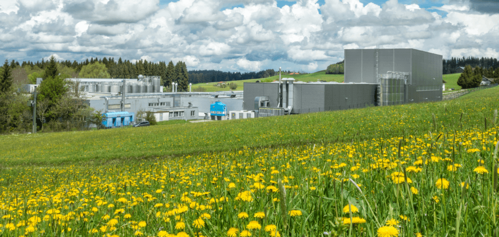Large factory facility in a green field